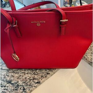 Michael Kors red tote purse. .